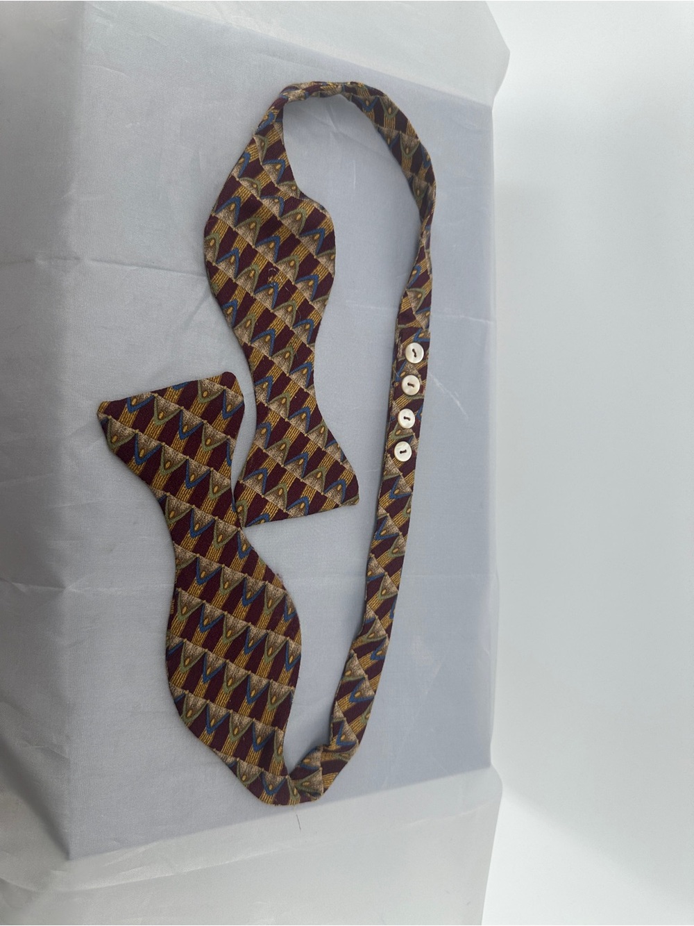 Carrot & Gibbs maroon and gold geometric design silk bow tie